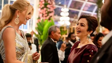 Reuters Nita Ambani, wife of Mukesh Ambani, the Chairman of Reliance Industries, shares a moment with Ivanka Trump during pre-wedding celebrations of Ambani's son Anant Ambani and Radhika Merchant, daughter of industrialist Viren Merchant, in Jamnagar, Gujarat, India, March 1, 2024
