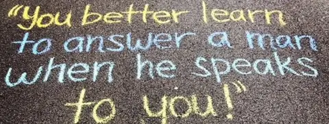 Sophie Sandberg A catcall reading: "You better learn to answer a man when he speaks to you" written on the ground