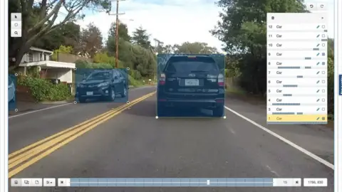 Samasource Computer screen showing cars in a street