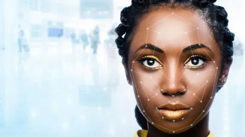 Getty Images Black woman's face being scanned