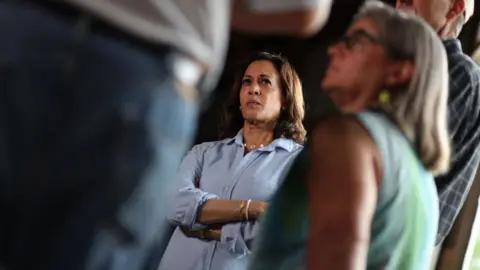 Justin Sullivan/Getty Images Kamala Harris speaks with voters in Iowa