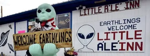 Getty Images A model alien stands outside the Little A'Le'Inn in Rachel, where Alienstock is taking place