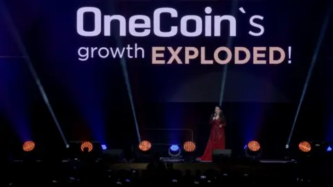 OneCoin Dr Ruja speaking at Wembley