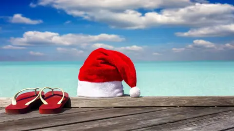 Getty Images Santa hat and flip-flops