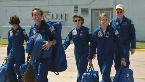 NASA These five astronauts composed the crew for the STS-41-G mission aboard the Space Shuttle Challenger. Leading the way is Astronaut Robert L. Crippen, the crew commander. He's followed by (from left to right), Sally K. Ride, Kathryn D. Sullivan, David C. Leestma, and Jon A. McBridge.