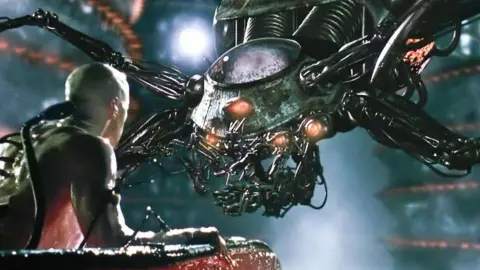 Alamy An awakened Neo is confronted by the reality of machines 'farming' humanity outside the matrix