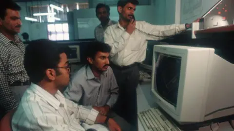Getty Images Employees at Infosys use computers to do their work March 12, 1996 in Bangalore, India. Bangalore, housing over 6 million people with a thriving business center, is considered the IT capital of India and often called the "Silicon Valley of India" because of the high concentration of software technology-related activity.