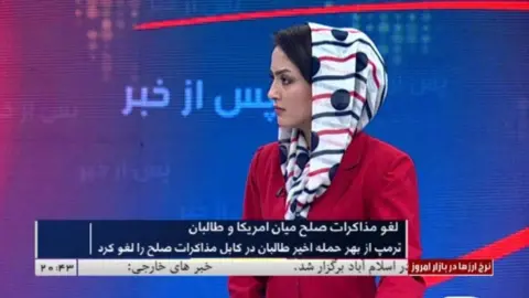 Supplied photo Afghan journalist Basira Joya on TV