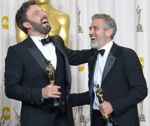 Getty Images Ben Affleck (L) and George Clooney celebrating after winning Best Picture Oscar for Argo in 2013, which was the last time Warner Bros. won the top award