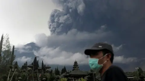 Reuters Mount Agung volcano erupts as seen from Besakih Temple in Karangasem, Bali, Indonesia on 26 November 2017.