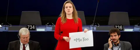 Reuters MEP Terry Reintke holds a placard with the hashtag "MeToo" during a debate in the European Parliament