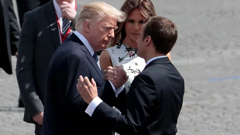 Getty Images Donald Trump and Emmanuel Macron demonstrated everything a handshake should not be during their awkward exchange in Paris (Credit: Getty Images)
