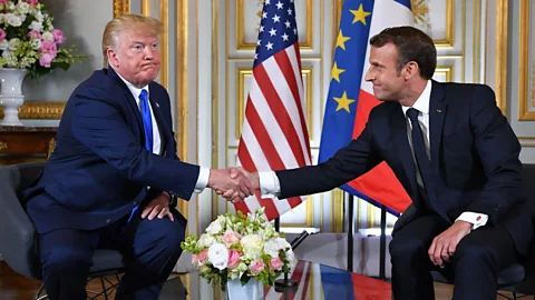 Getty Images Donald Trump and Emmanuel Macron have a bit of a history when it comes to intense handshakes (Credit: Getty Images)