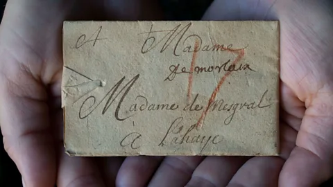 Unlocking History Research Group A rare unopened example of a locked letter, with red crayon marking the postage cost (Credit: Unlocking History Research Group)