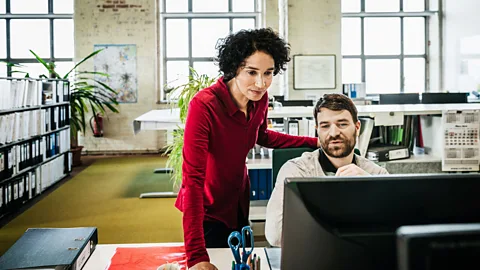 Getty Images There's a psychological tendency for bosses to trust in-person workers more quickly, leaving remote workers at a disadvantage (Credit: Getty Images)