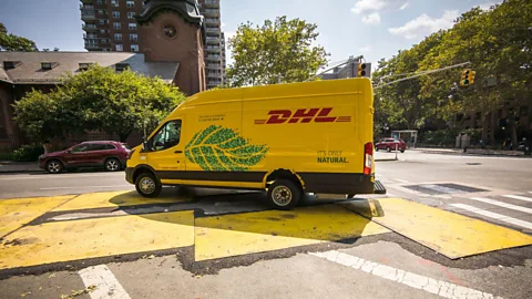 Alamy Logistics company DHL has introduced electric delivery vans into its fleet to help meet its 2050 net zero pledge (Credit: Alamy)