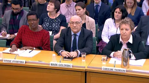 Reuters Oxfam International's director Winnie Byanyima, chief executive Mark Goldring and chair Caroline Thomson appeared before MPs