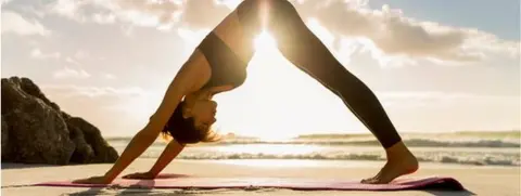 Getty Images Woman doing yoga