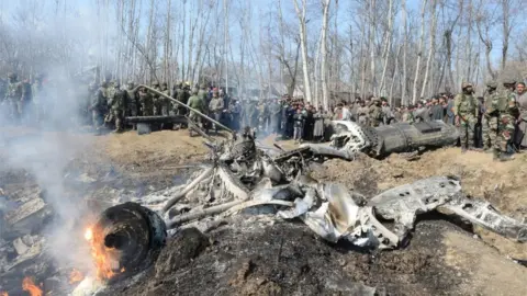 AFP The remains of an Indian Air Force jet after it came down in India's Budgam district