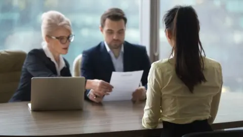 Getty Images Woman with HR managers