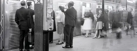 Getty Images Passengers wait to board a subway train at Times Square station, New York, in the 1950s