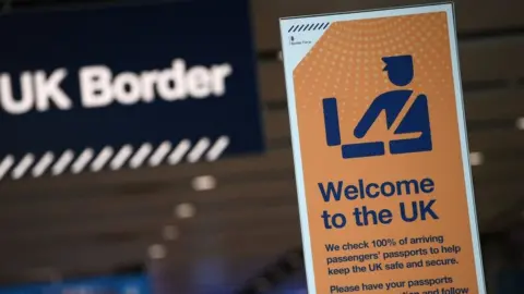 Getty Images UK border signage at passport control in Arrivals in Terminal 2 at Heathrow Airport