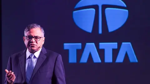 Getty Images Natarajan Chandrasekaran, chairman of Tata Sons, speaks during the launch of the Tata Nexon EV electric car, in Mumbai on January 28, 2020