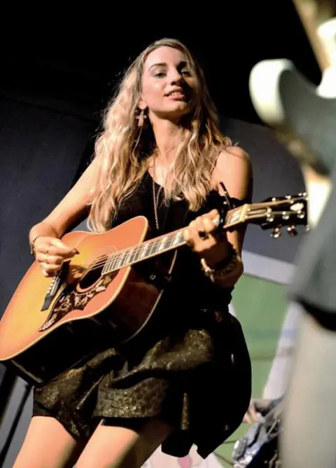 Eric Duvet Talia Dean performing on stage