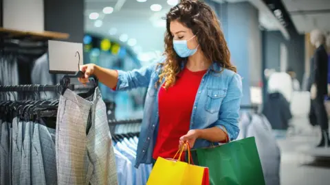 Getty Images shopper in fashion shop