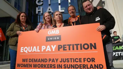 BBC Pay petition placard outside council offices