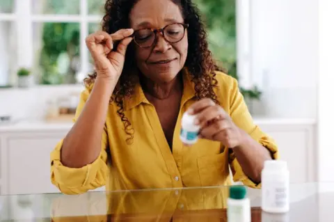 Getty Images woman with pills