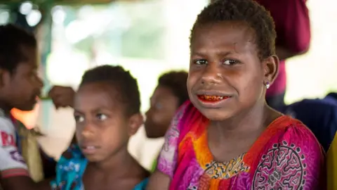 Kathleen Prior Mother chewing betel nut with daughter