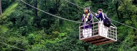 Sisters Radhika and Yashoda in the Himalayan mountains of northern India - crossing the Bhagirathi River