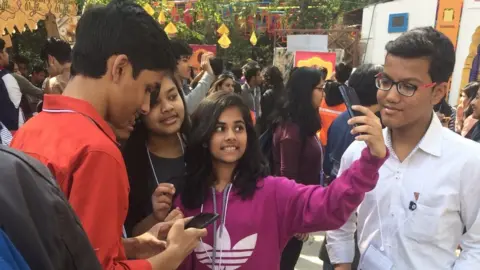 Youngsters taking selfies