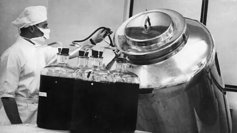 Mixing strains of killed polio virus to prepare the final vaccine in 1956 (Getty Images)