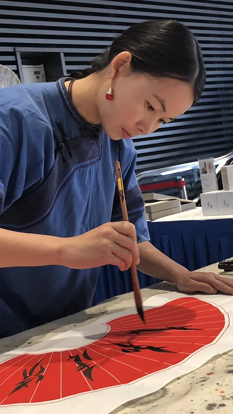 Xin Hu Today, Xin is one of seven “inheritors” of the language and has learned to read, write, sing and embroider Nüshu (Credit: Xin Hu)