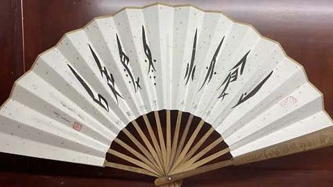 Xin Hu Coded Nüshu messages among women were embroidered on fans, scarves and cotton belts (Credit: Xin Hu)