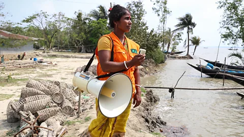 Catherine Davison Rina Sarkar, a Cyclone Preparedness Programme (CPP) volunteer, during an early warning drill in Chila village, Bangladesh (Credit: Catherine Davison)
