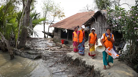 Catherine Davison Volunteers in Bangladesh's Cyclone Preparedness Programme (CPP) take part in an early warning drill in Chila village, April 2022 (Credit: Catherine Davison)