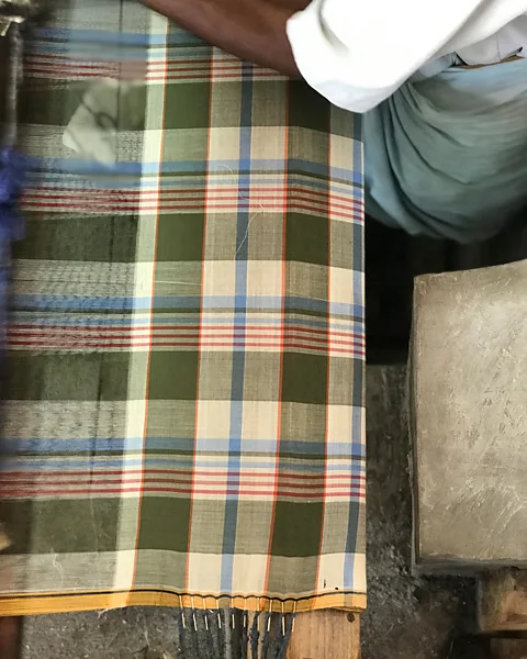 Original Madras Trading Company Woven by handloom on muslin cloth, Madras check has its origins in Southern India (Credit: Original Madras Trading Company)