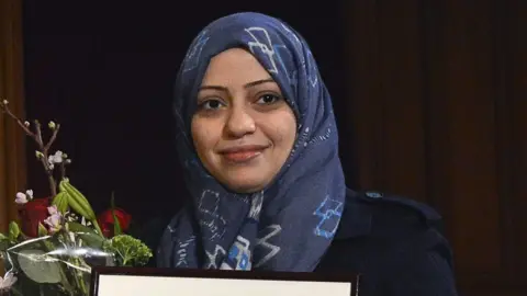EPA Samar Badawi, receives the Olof Palme prize at the 2nd chamber of the Swedish Parliament in Stockholm, Sweden, 25 January 2013 (
