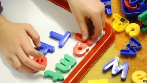 PA Child playing with letters