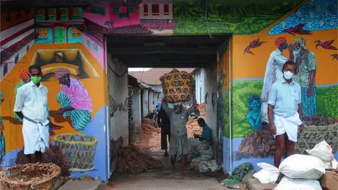 Getty Images Coconut Street in Valiyangadi is active after the Covid lockdown relaxations. The street is open three days a week in Kozhikode,Kerala on June 24, 2021 in Kozhikode, India. (Photo by C. K Thanseer/DeFodi images via Getty Images)