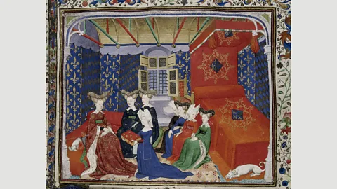 Master of the Cité des Dames/British Library Christine de Pizan, shown here in a 15th-century miniature presenting her book, imagined utopia as a female-only city (Credit: Master of the Cité des Dames/British Library)
