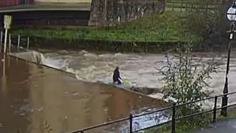 Marine Accident Investigation Branch A CCTV image of River Cleddau. The shows the figure, which is one of the paddleboarders from the group, at the weir. 