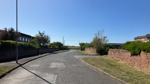 The address at which Skyline PM had been registered on Pinfold Lane in Hoylake, close to Royal Liverpool Golf Club, did not exist

A cul-de-sac called Pinfold Lane. It is a short road leading to a gate, through which is the course of the Royal Liverpool Golf Club. There are low walls on either side of the grass verges.