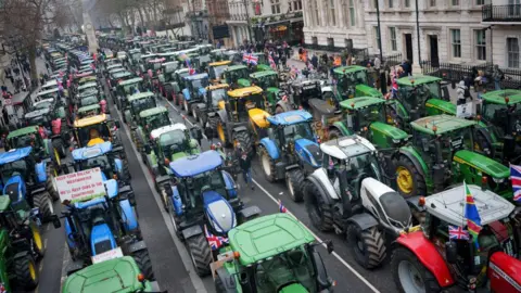 Getty Images Lines and lines of tractors parked in protest in central London